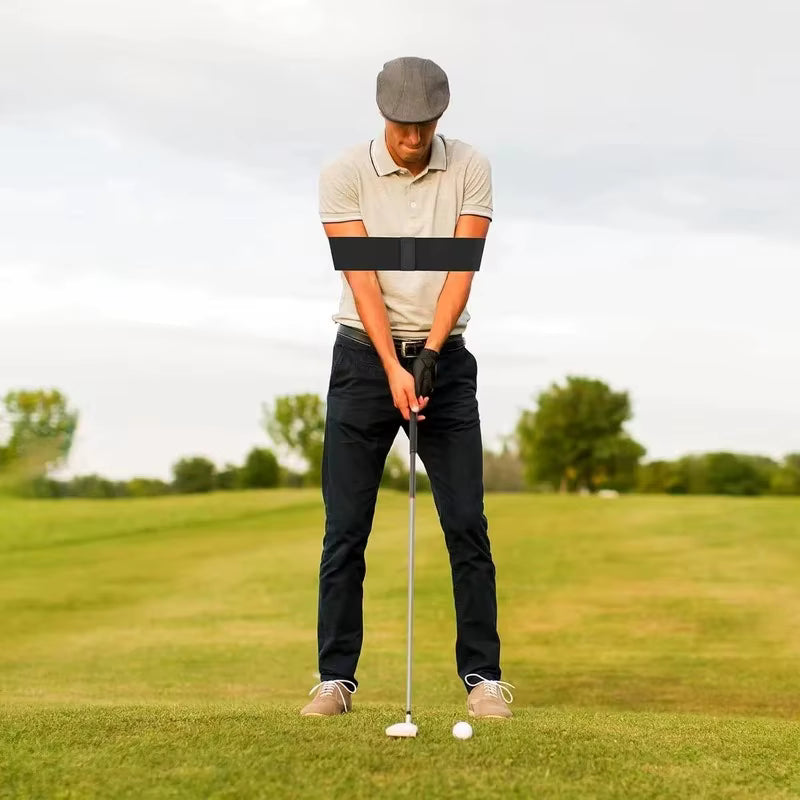 Golfer at address wearing the Unison Swing Band around both upper arms